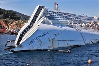 Bow with lettering name Costa Concordia of capsized cruise ship