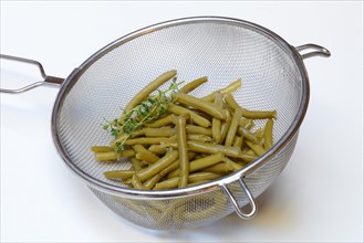 Green beans and savory in colander