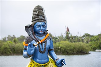 Statue of Lord Shiva at the sacred lake of Ganga Talao in the south of the island of Mauritius