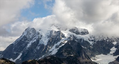 Cloudy mountain with snow and glacier