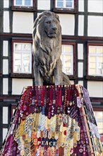 Tie-draped lion monument of a campaign for peace by Soroptimist International