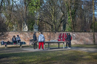 Wall at the southern cemetery with youth playing table tennis