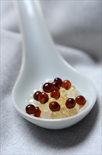 Aceto pearls in ceramic spoon
