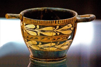 A scyphos is the name given to an ancient Greek drinking bowl with a low foot and two horizontal handles