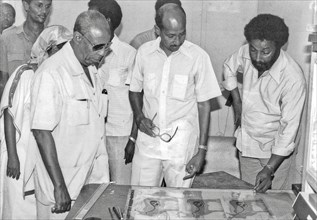 Somali President Siad Barre in front of design of the first colour poster in the country