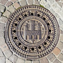 Manhole cover with coat of arms of the city of Freiburg im Breisgau