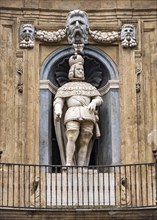 Statue of King Philip III on facade of Quattro Canti