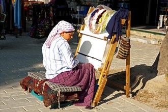 Bazaar Street with carpet weaver