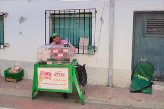 El Gordo lottery ticket seller with stall in village