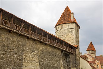 Medieval city fortification with battlements and defence towers