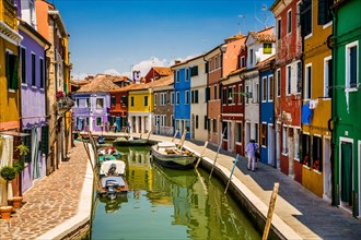 Burano Island with its colourful fishermen's houses along canals in the Venice Lagoon