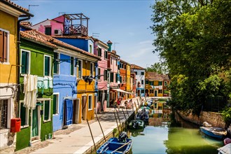 Burano Island with its colourful fishermen's houses along canals in the Venice Lagoon