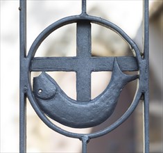 Christian symbol fish and cross on fence