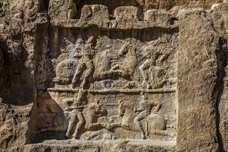 Relief of Bahram II under the rock tomb of Darius I. Battle scene