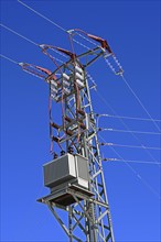 High-voltage pylon with transformer