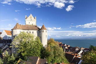 Meersburg Castle in the sunshine with a view of the Alps