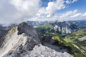 View from the summit of Lamsenspitze over rocky ridge to Schafkarspitze