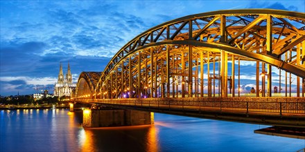 Cologne Cathedral Skyline and Hohenzollern Bridge with River Rhine in Germany by Night Panorama in Cologne