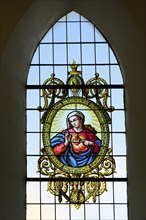 Leaded glass window with image of the Virgin Mary