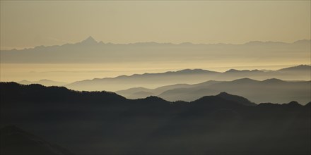 View from Pizzoni di Laveno on silhouettes of mountain ranges with Monte Viso in the distance