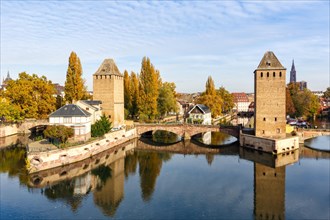 Petite France bridge over river Ill water with tower Alsace in Strasbourg