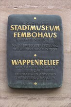 Information board about a coat of arms relief on the Fembohaus