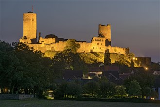 Illuminated castle ruins of the medieval Stauferburg Muenzenberg