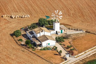 Traditional finca farm with windmill landscape aerial view in Majorca
