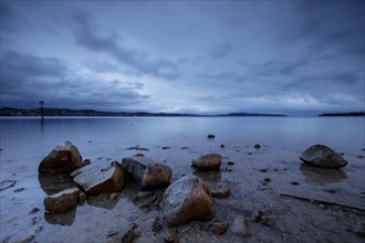 Shore in the morning during a storm on Lake Constance