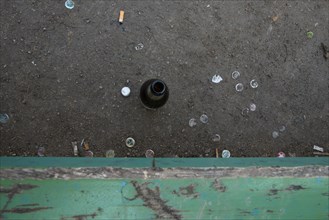 Empty beer bottle on a park bench at Heidelberger Platz