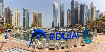 Dubai Marina Logo and Harbour Skyline Architecture Luxury Holiday in Arabia Panorama in Dubai