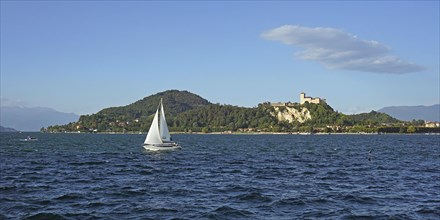 Sailing boat and castle of Angera or Rocca Borromeo di Angera