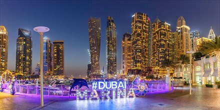 Dubai Marina Logo and Harbour Skyline Architecture Luxury Holiday in Arabia Panorama by Night in Dubai