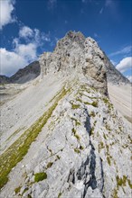 Exposed rocky ridge with summit of the Lamsenspitze
