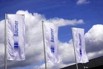Three flags of the company Baumer