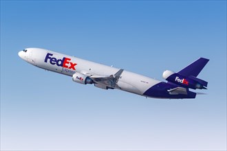 A Douglas MD-11F aircraft of FedEx Express with registration N619FE takes off from Dubai Airport