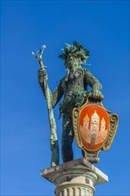 Statue Wilder-Mann with coat of arms of Salzburg