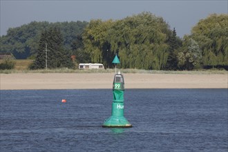 Buoy and beach on the Weser
