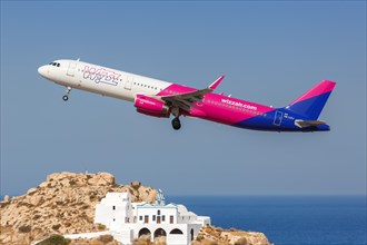 An Airbus A321 aircraft of Wizzair with registration number HA-LXJ at the airport in Santorini