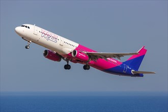 An Airbus A321 aircraft of Wizzair with registration number HA-LTI at the airport in Santorini
