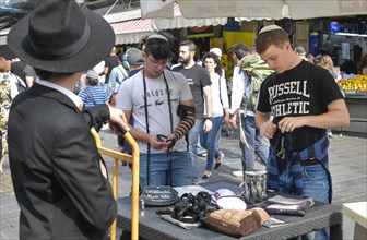 Information stand of Orthodox Jews with Tefillin