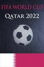Fifa World Cup 2022 with a football and the Qatar flag on a black slate