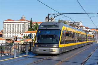 Modern light rail Metro do Porto tramway public transport transport traffic on the bridge Ponte Dom Luis I in Porto