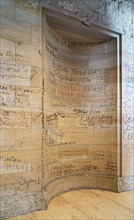 Stone fragments of the 1945 Reichstag ruins reused with original Russian writing