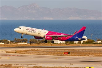 An Airbus A321 aircraft of Wizzair with registration number HA-LXD at the airport in Santorini