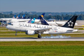 A Lufthansa CityLine Airbus A319 aircraft with registration D-AILP and Star Alliance special livery at Munich Airport