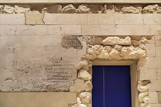 Stone fragments of the 1945 Reichstag ruins reused with original Russian writing