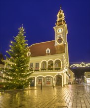 View to the main square with town hall with Christmas lights