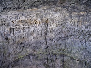 Signs and letters carved in stone on the rock formation Hamburger Wappen