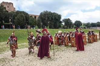Traditional group of Roman legionaries in historical uniform equipment practising in Circus Maximus